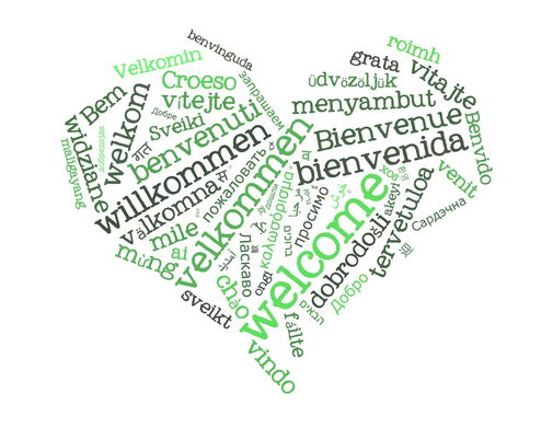 Willkommen in unterschiedlichen Sprachen und Größen, in schwarz und grün, zu einem Herz geformt.